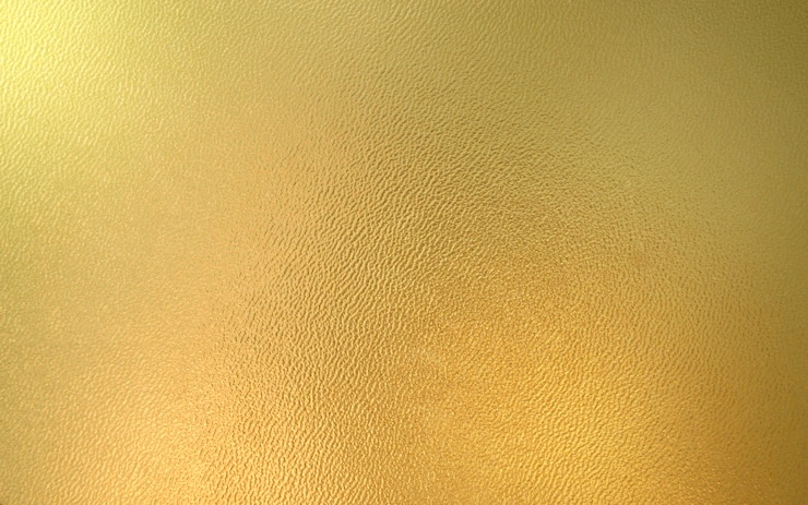 Foto schöner goldhintergrund mit glatter hautbeschaffenheit