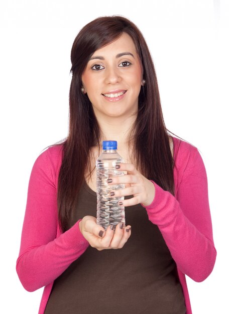 Schönes Brunettemädchen mit der Wasserflasche lokalisiert auf a über weißem Hintergrund