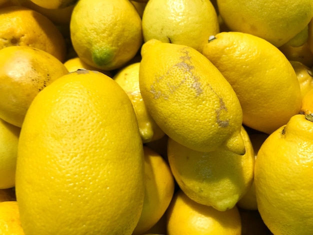 Schönes gelbes reifes südliches natürliches saures Vitamin köstliche reife helle Zitronen Texturhintergrund