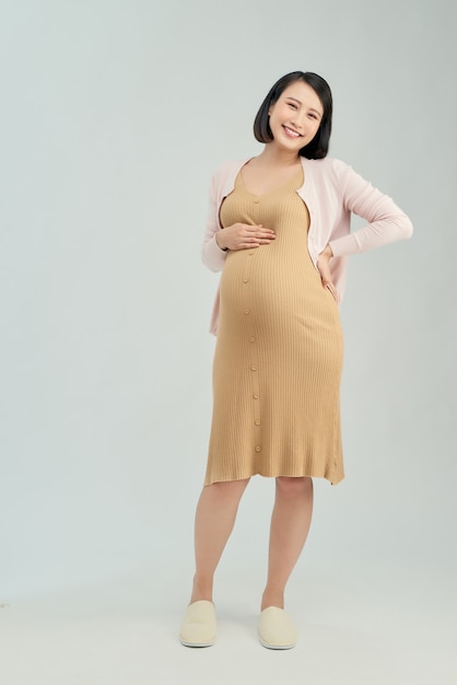 Schwangere Frau auf hellem Hintergrund