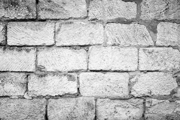 Schwarz-Weiß-Textur der alten Mauer für den Hintergrund.