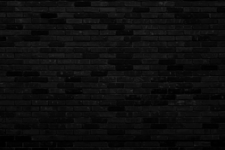 Schwarze Backsteinmauer Fassade eines alten Gebäudes