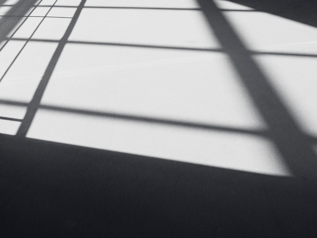 Foto schwarze schatten auf dem boden, abstrakte linien, schatten als hintergrund