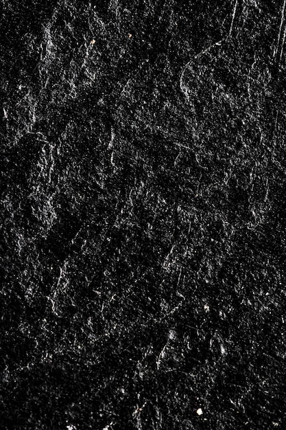 Schwarze Steinstruktur als abstraktes Hintergrunddesignmaterial und strukturierte Oberfläche