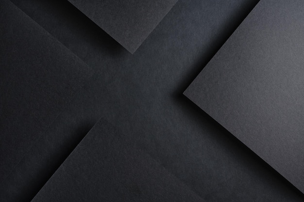 Foto schwarzer hintergrund schwarze blätter papier schwarzes modell geometrische formen dreiecke scharfe ecken