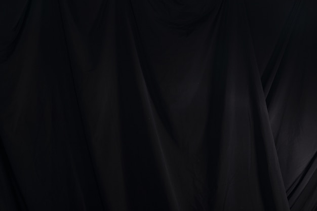 Schwarzer Vorhang drapieren Welle, Tapeten-Hintergrund-Beschaffenheits-Detail