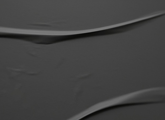 Schwarzer zerknitterter und zerknitterter Papierplakat-Texturhintergrund