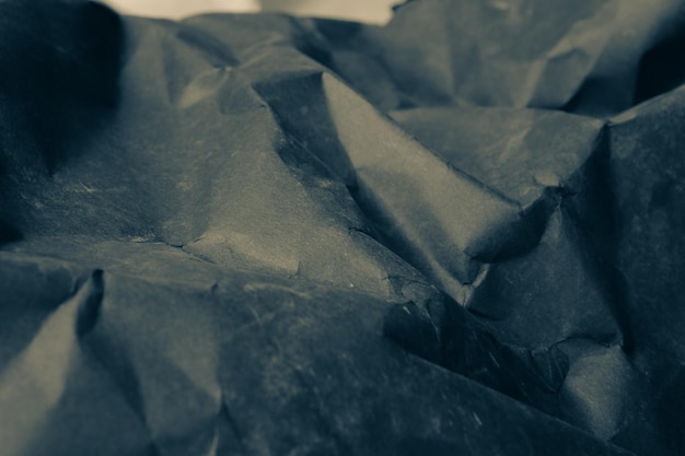 schwarzer zerknitterter zerknitterter papierhintergrund schmutzbeschaffenheitshintergrund