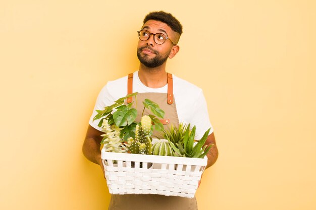 Schwarzes Afro-Mann-Gärtnerkonzept