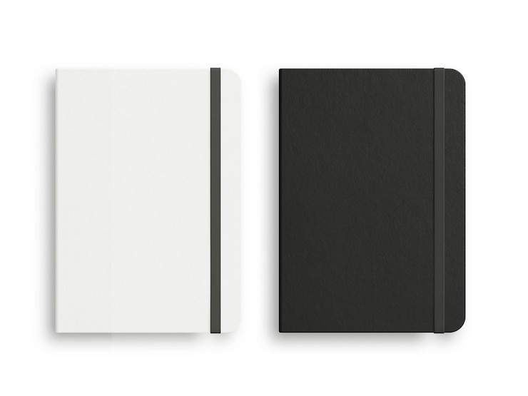 Foto schwarzweiss-moleskine getrennt auf dem weißen hintergrund
