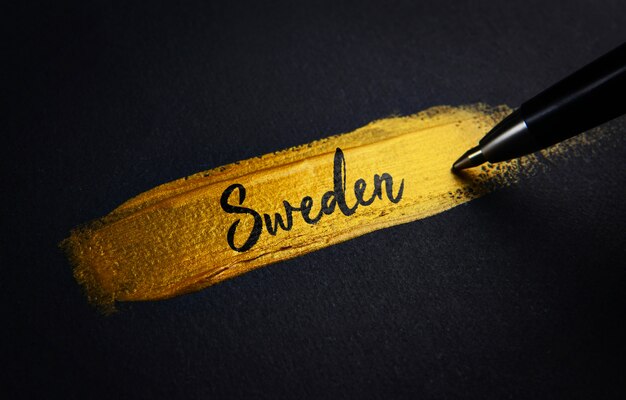 Schweden-Handschrift-Text auf goldenem Pinsel-Anschlag