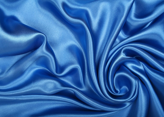 La seda azul suave y elegante puede usarse como fondo