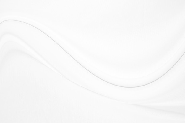 Seda blanca suave y elegante o textura de tela satinada de lujo que se puede utilizar como fondo de boda Diseño de fondo lujoso