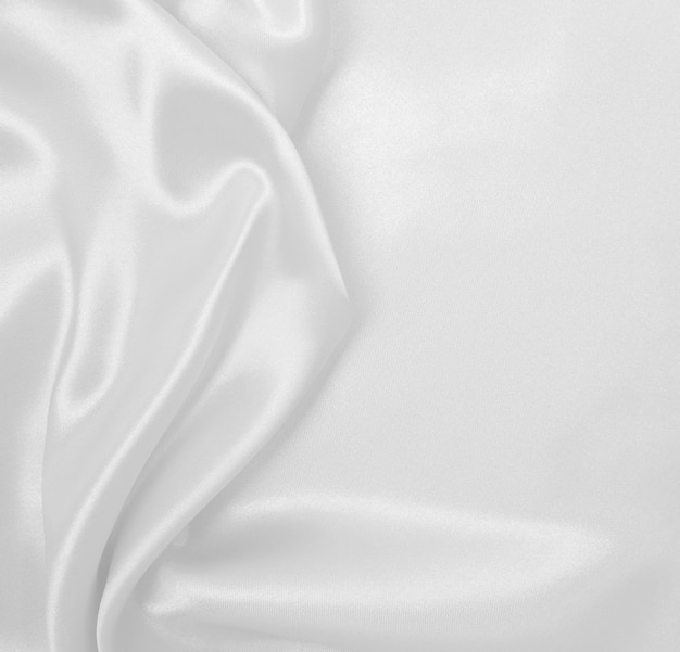 Foto seda branca elegante suave ou textura de pano de cetim de luxo como plano de fundo do casamento