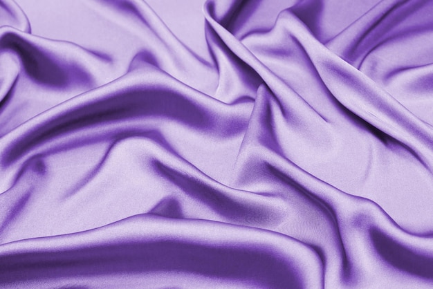 Seda roxa ou textura de tecido de luxo acetinado pode usar como fundo abstrato Vista superior