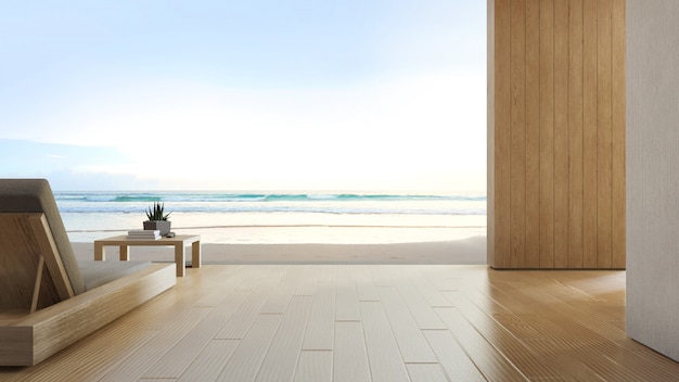 Seeansichtterrasse und -bett im modernen Luxusstrandhaus mit blauem Himmel