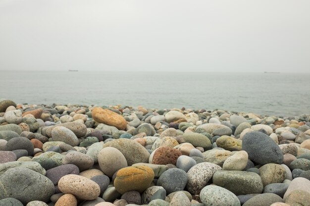 Seesteinhintergrund am Meer an einem Strand