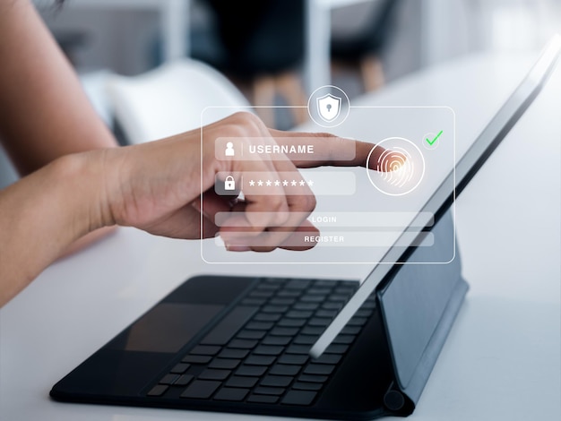 Segurança cibernética com conceito de tecnologia de autenticação biométrica escudo de segurança com ícone de digitalização do dedo na página de login virtual na tela do computador tablet para validar a senha verificação de identidade
