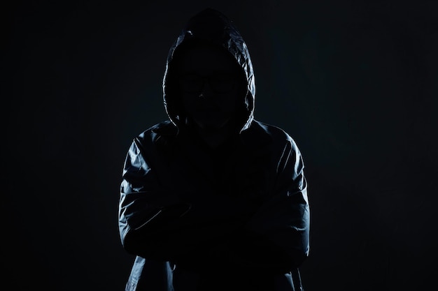 Segurança de retrato de hacker irreconhecível e conceito de crime de tecnologia