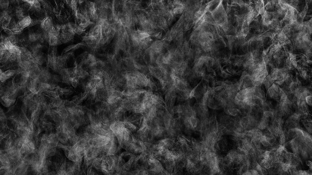 Foto sehr kleine dampftropfen in chaotischer bewegung auf schwarzem texturhintergrund