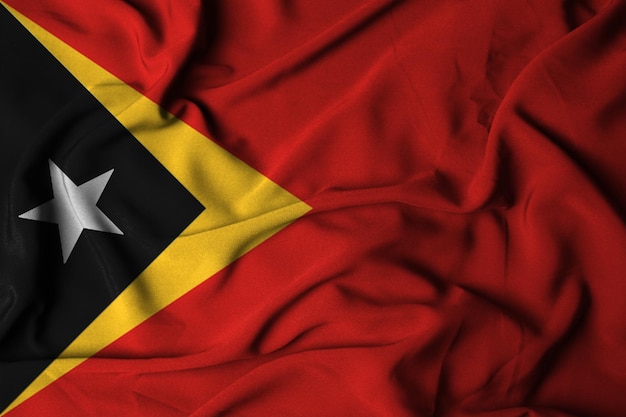 Selektiver Fokus der Osttimor-Flagge mit wehender Stofftextur 3D-Darstellung