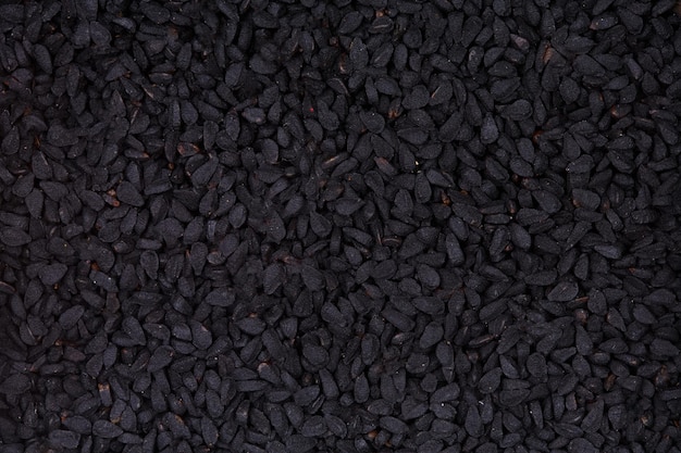 Sementes de cominho preto Nigella sativa closeup fundo