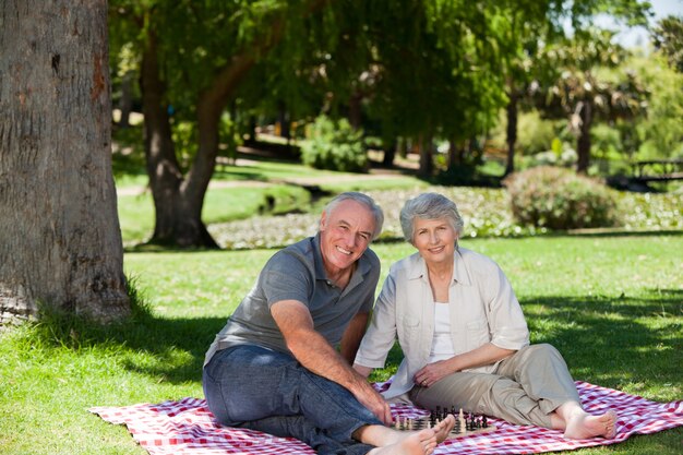 Senior couple picnicking in the garden