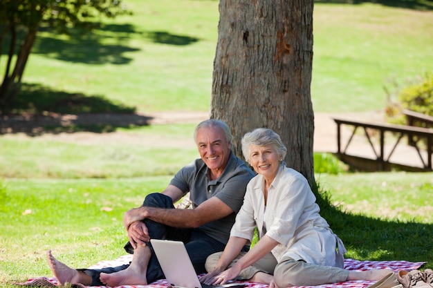 Senior couple picnicking in the garden