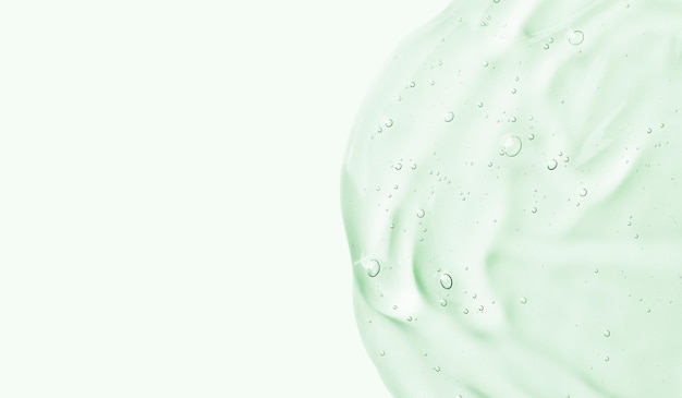 Serum-Gel-Abstrich auf grünem Hintergrund Kosmetische transparente Gel-Serum-Textur