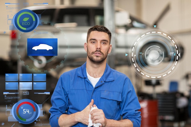 Foto serviço de automóveis, reparação, manutenção e conceito de pessoas - mecânico de automóveis ou ferreiro na oficina