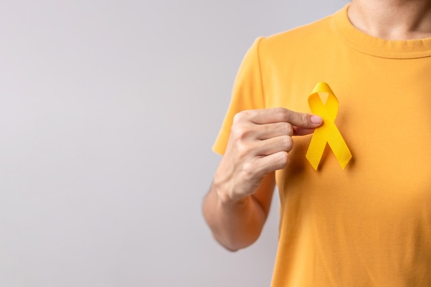 Setembro amarelo dia de prevenção do suicídio sarcoma na infância e câncer de bexiga mês de conscientização fita amarela para apoiar a vida e a doença das pessoas conceito de saúde e dia mundial do câncer