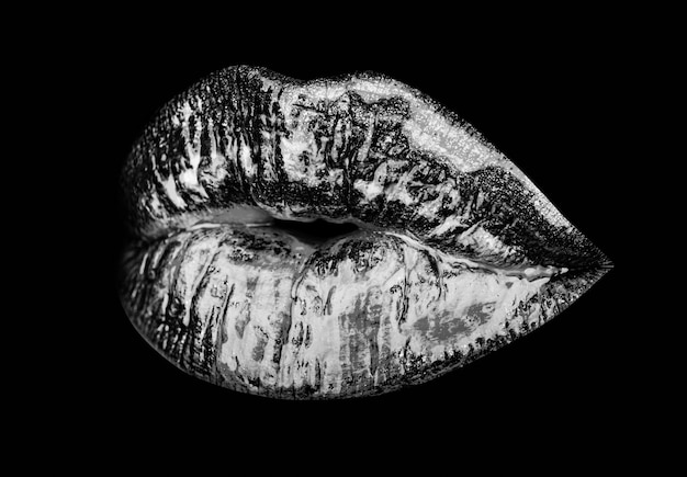 Sexy Lippen-Neon-Lippenstift-Goldmund lokalisiert auf Schwarzem