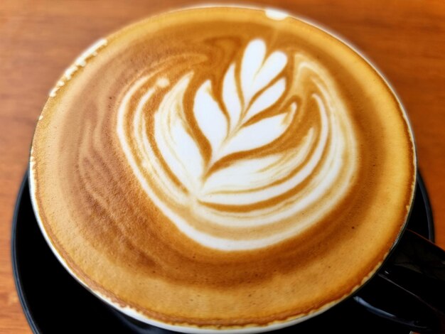 Foto sideway shop kaffee nahaufnahme heißer latte art kaffee hintergrund