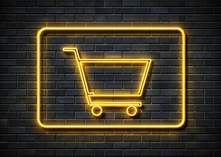 Foto signo de carrito de compras de neón con fondo de pared de ladrillo para la venta
