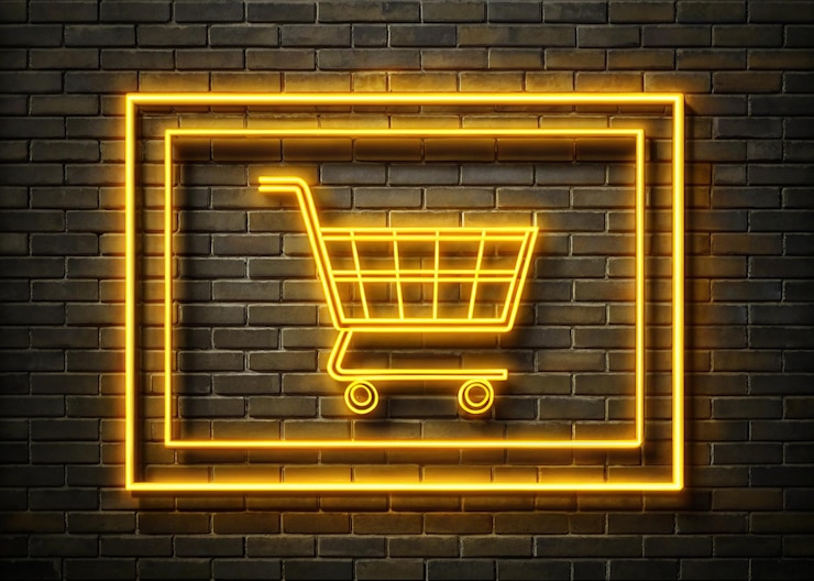 Foto signo de carrito de compras de neón con fondo de pared de ladrillo para la venta