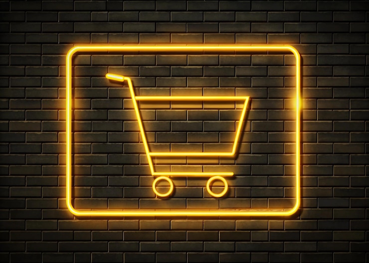 Foto signo de carrito de compras de neón con fondo de pared de ladrillo para la venta
