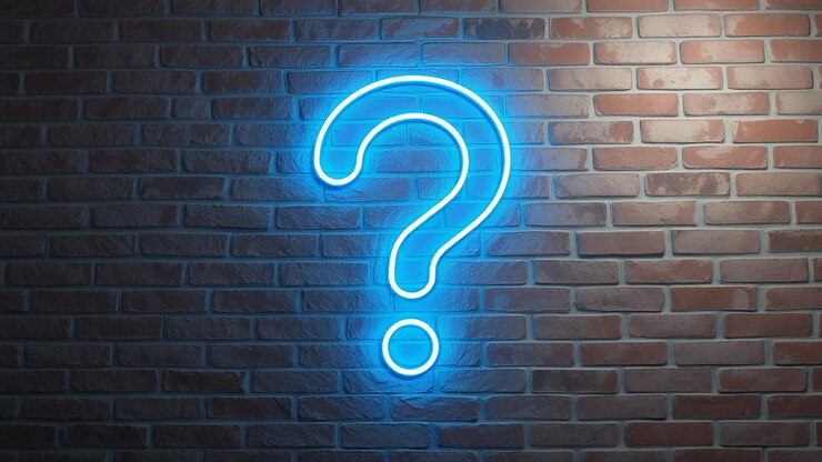 Foto un signo de interrogación azul de neón en una pared de ladrillo