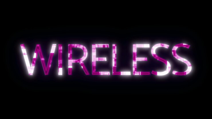 Foto signo de neón con la palabra wireless en colores rosa y blanco sobre un fondo negro