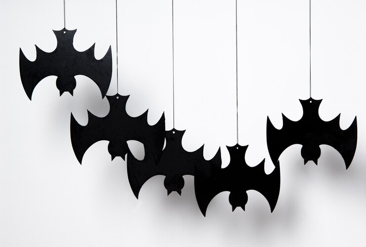 Foto silhueta de halloween de muitos morcegos pretos em um fundo branco