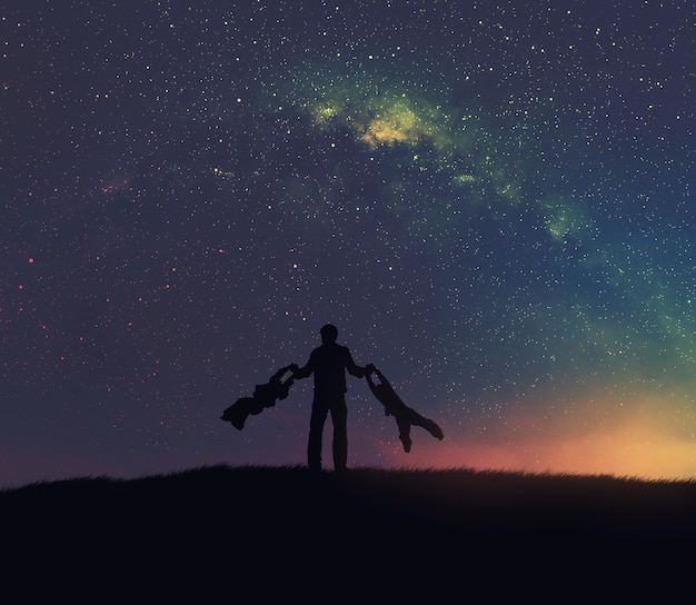 Silhueta de un hombre y niños contra el cielo nocturno