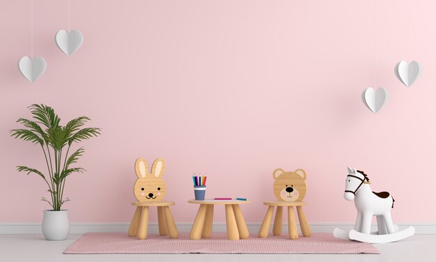 Silla y mesa en el interior de la habitación infantil rosa