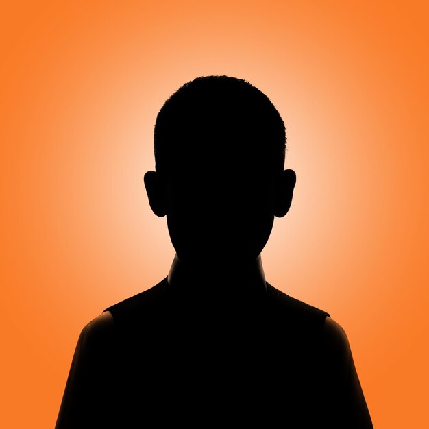 Foto silueta de un niño avatar de un niño posando sobre un fondo naranja