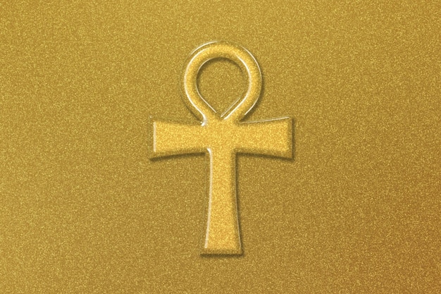 Símbolo Ankh, signo de la llave de la vida, fondo dorado