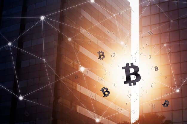 Símbolo de bitcoin brillante con dos rascacielos