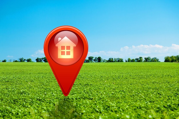 Foto símbolo de casa com ícone de pin de localização na terra em venda de imóveis ou conceito de investimento imobiliário