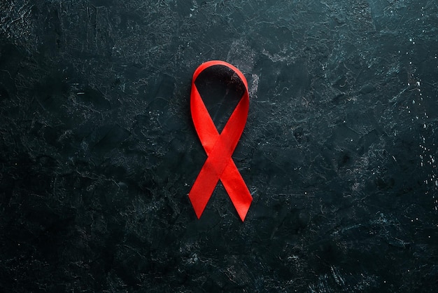 Símbolo de fita vermelha do Dia Mundial da AIDS Vista superior Espaço para cópia gratuita