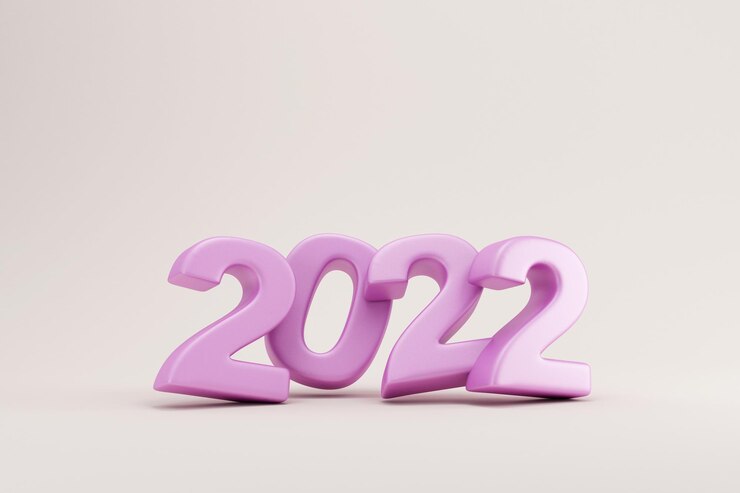 Foto símbolo púrpura del año nuevo 2022 sobre fondo de estudio ligero