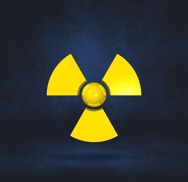 Foto símbolo radioativo isolado em uma superfície de estúdio azul escuro