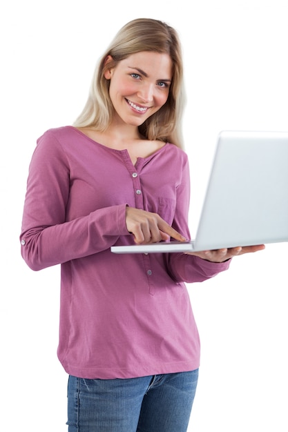 Smiling woman holding laptop