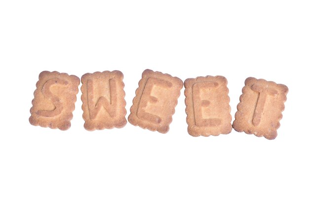 Sobre fondo de recorte blanco palabra SWEET establecidos a partir de cookies en el centro del bastidor